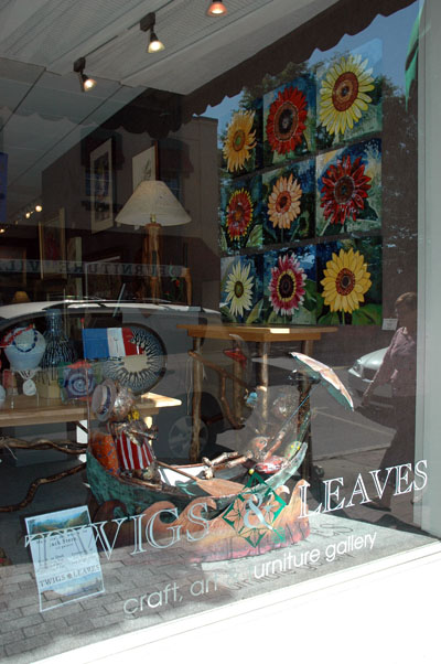 Cedar\'s Sunflower Art in Window of Twigs & Leaves Gallery, Waynesville, NC