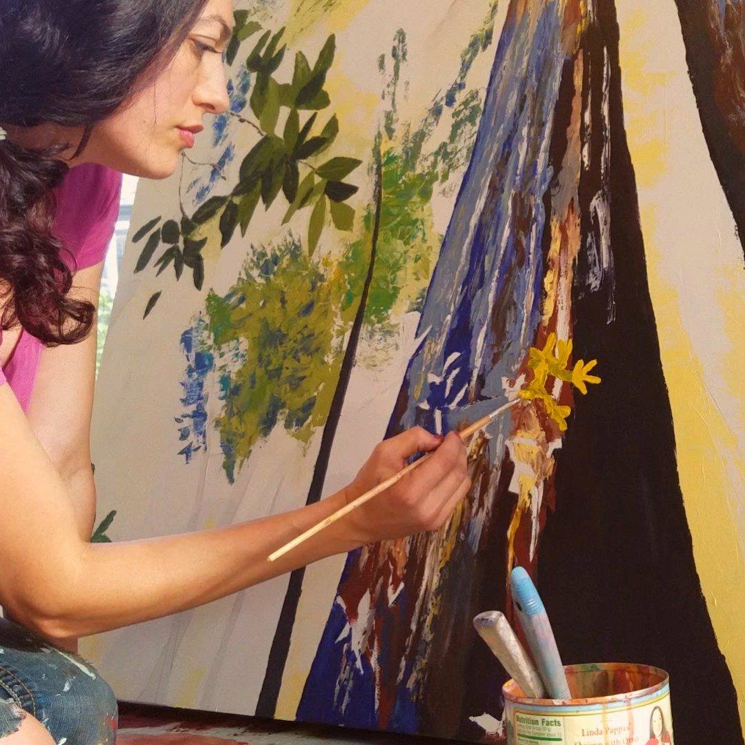 Artist Cedar Lee working in the studio