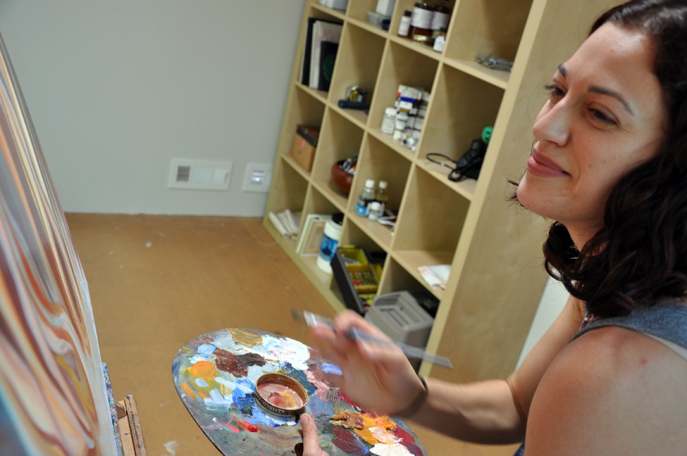 Artist Cedar Lee working in her studio.