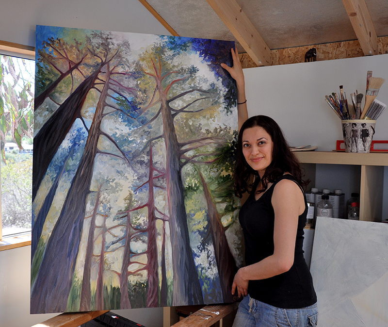 Artist Cedar Lee with her painting, Trees In The Morning. 48" x 36", Oil on Wood, © 2014 Cedar Lee