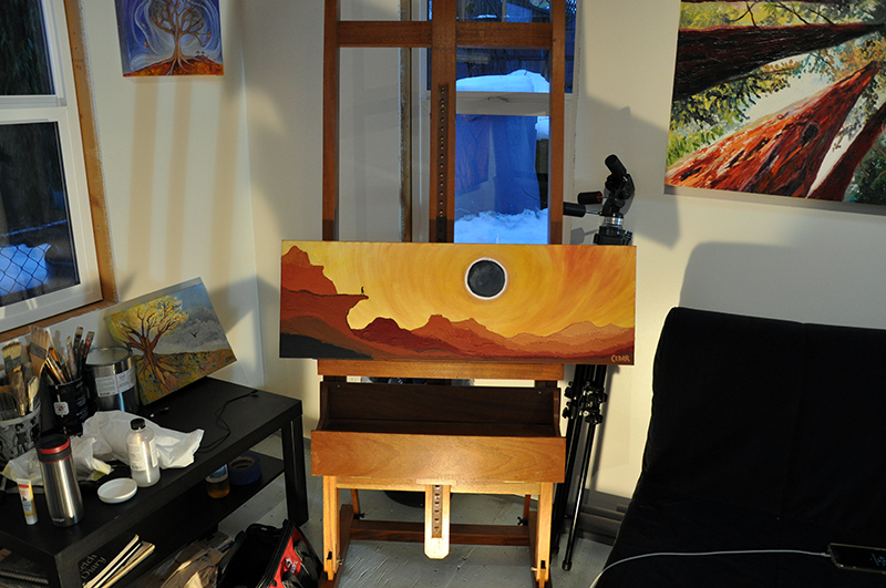 Art studio of Cedar Lee. On easel: Eclipse From the Precipice. 12" x 36", Oil on Canvas, © 2017 Cedar Lee