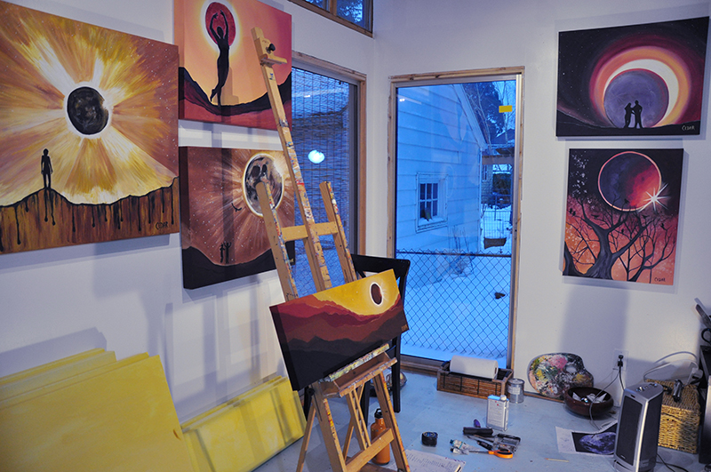 Cedar Lee Eclipse paintings in art studio