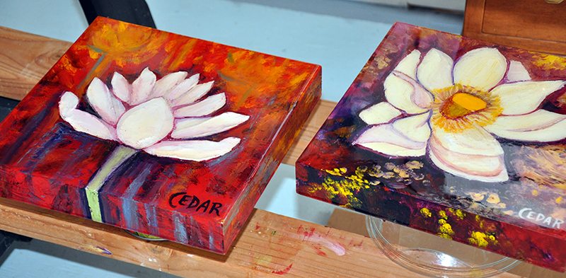 Cedar Lee Lotus paintings on drying rack