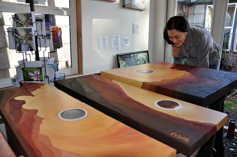 Eclipse paintings in Cedar Lee art studio