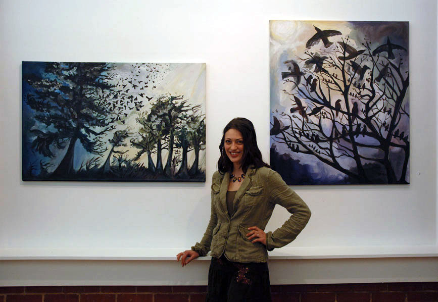 Cedar Lee with her paintings. Left: Approaching Storm. © 2005 Right. Birds at Sunrise. © 2005