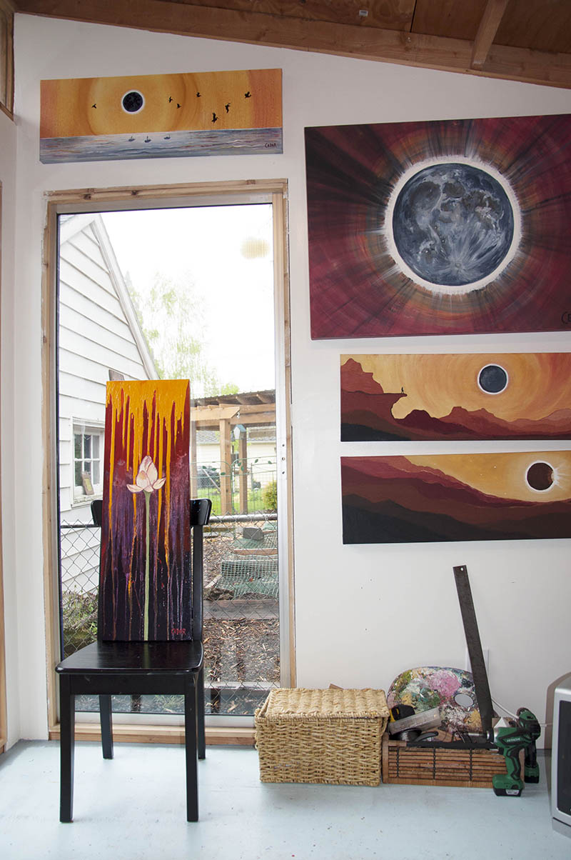 Cedar Lee artwork in studio: (left-right, top-bottom): Eclipse With Pelicans, Inherent Promise, The Big Eclipse, Eclipse From the Precipice, Eclipse Over Red Hills