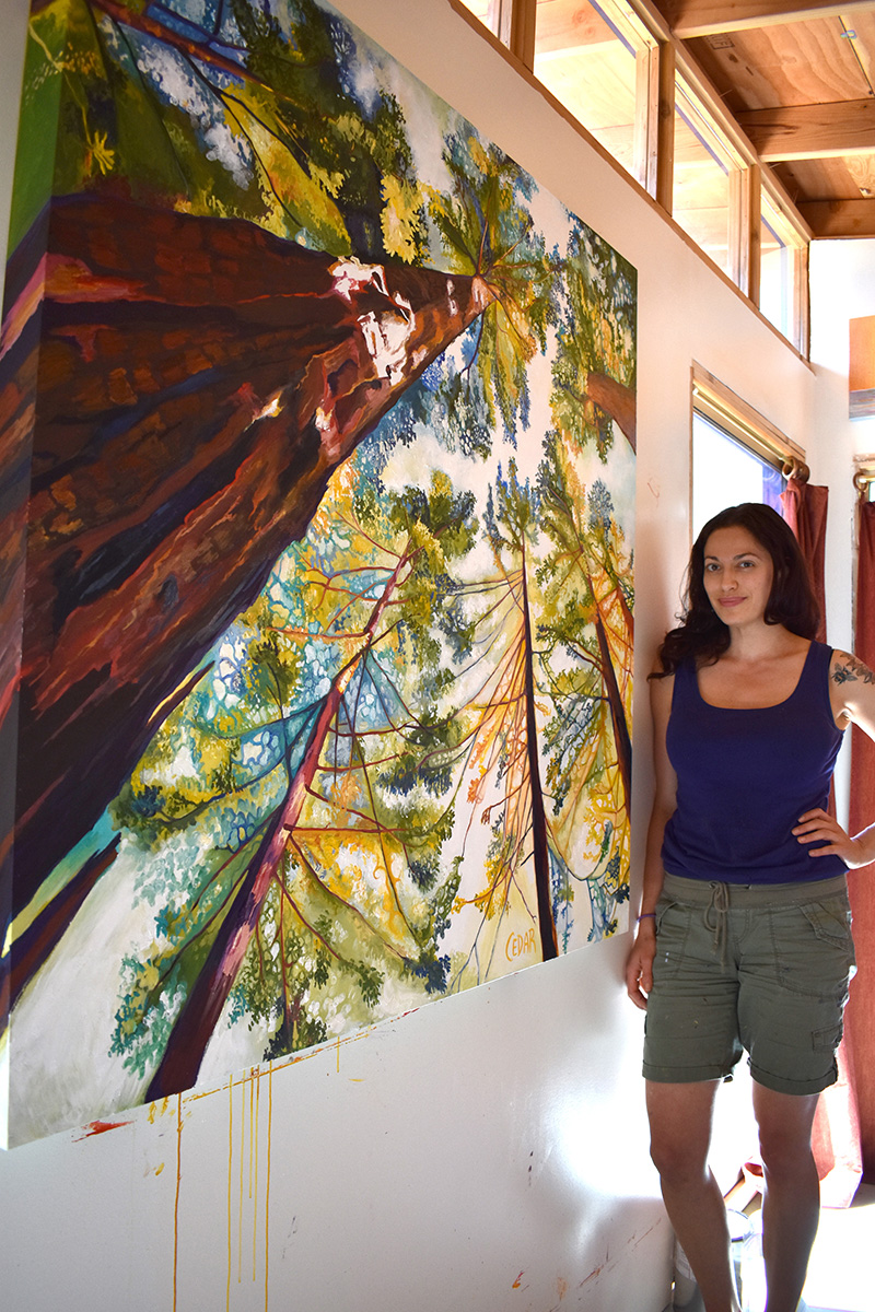 Artist Cedar Lee in studio. Painting: Sun-Dappled Sequoias. 48" x 48", Oil on Wood, © 2017 Cedar Lee