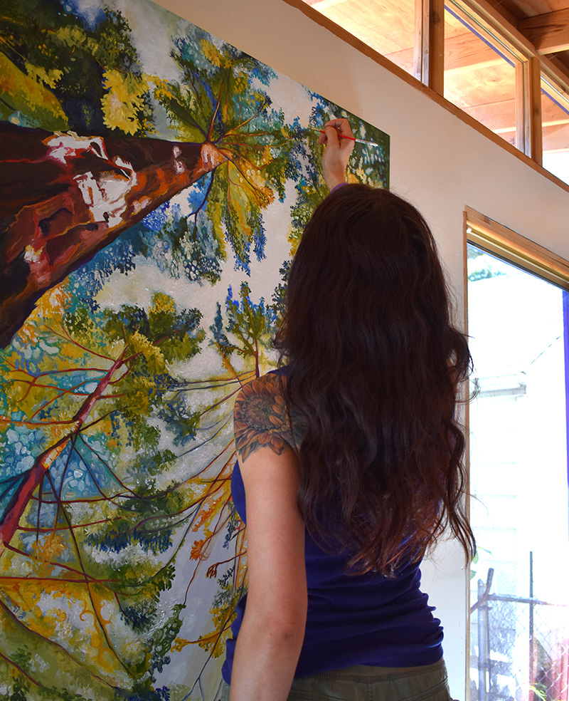 Artist Cedar Lee working in studio. Painting: Sun-Dappled Sequoias. 48" x 48", Oil on Wood, © 2017 Cedar Lee