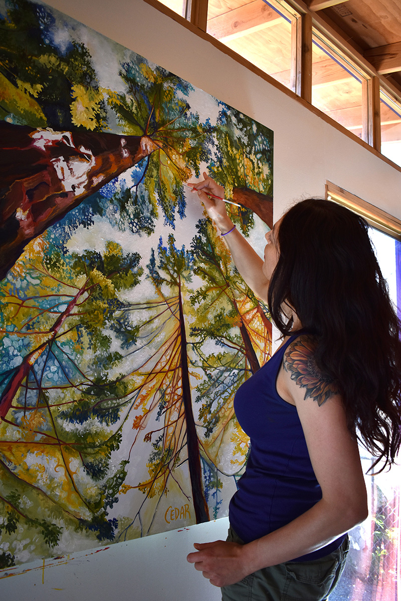 Artist Cedar Lee working in studio. Painting: Sun-Dappled Sequoias. 48" x 48", Oil on Wood, © 2017 Cedar Lee