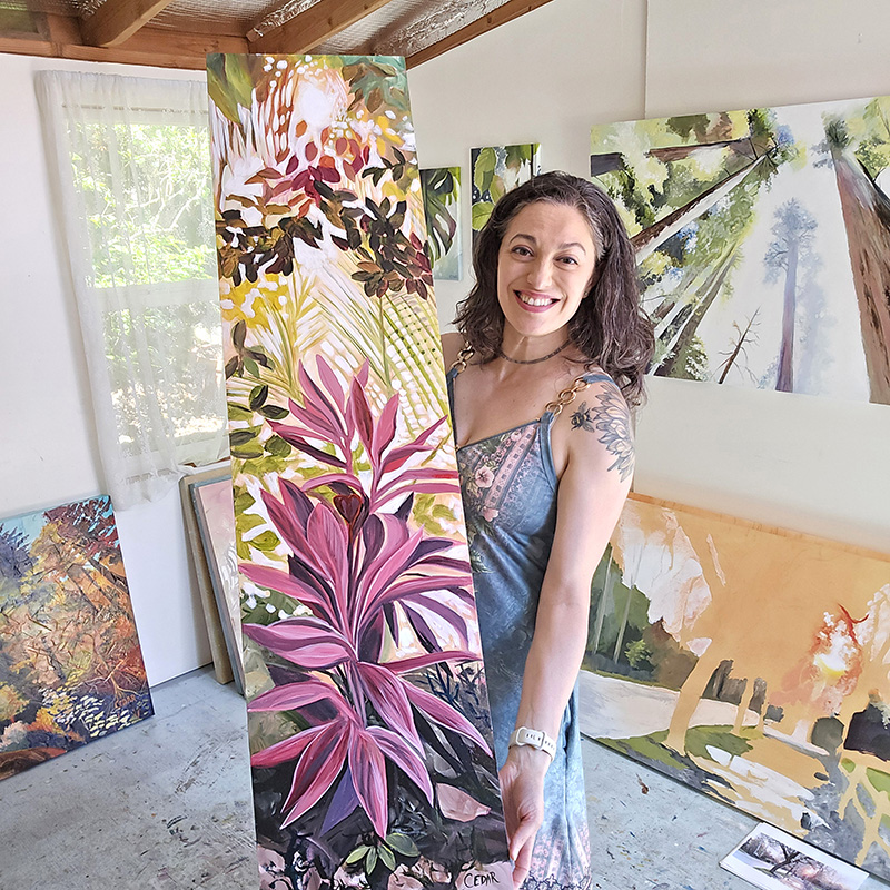 Aritst Cedar Lee in her studio with painting: Jungle in Pink